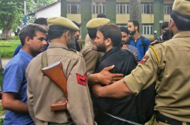 Handcuffed Kashmir student turned up at Kashmir University to give exam for 'Peace Building and Conflict Mitigation'