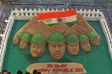 Faces of soldiers and Tricolor Flag made by Sand