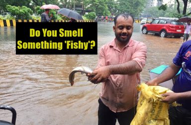 Man with a fish on the road in Mumbai